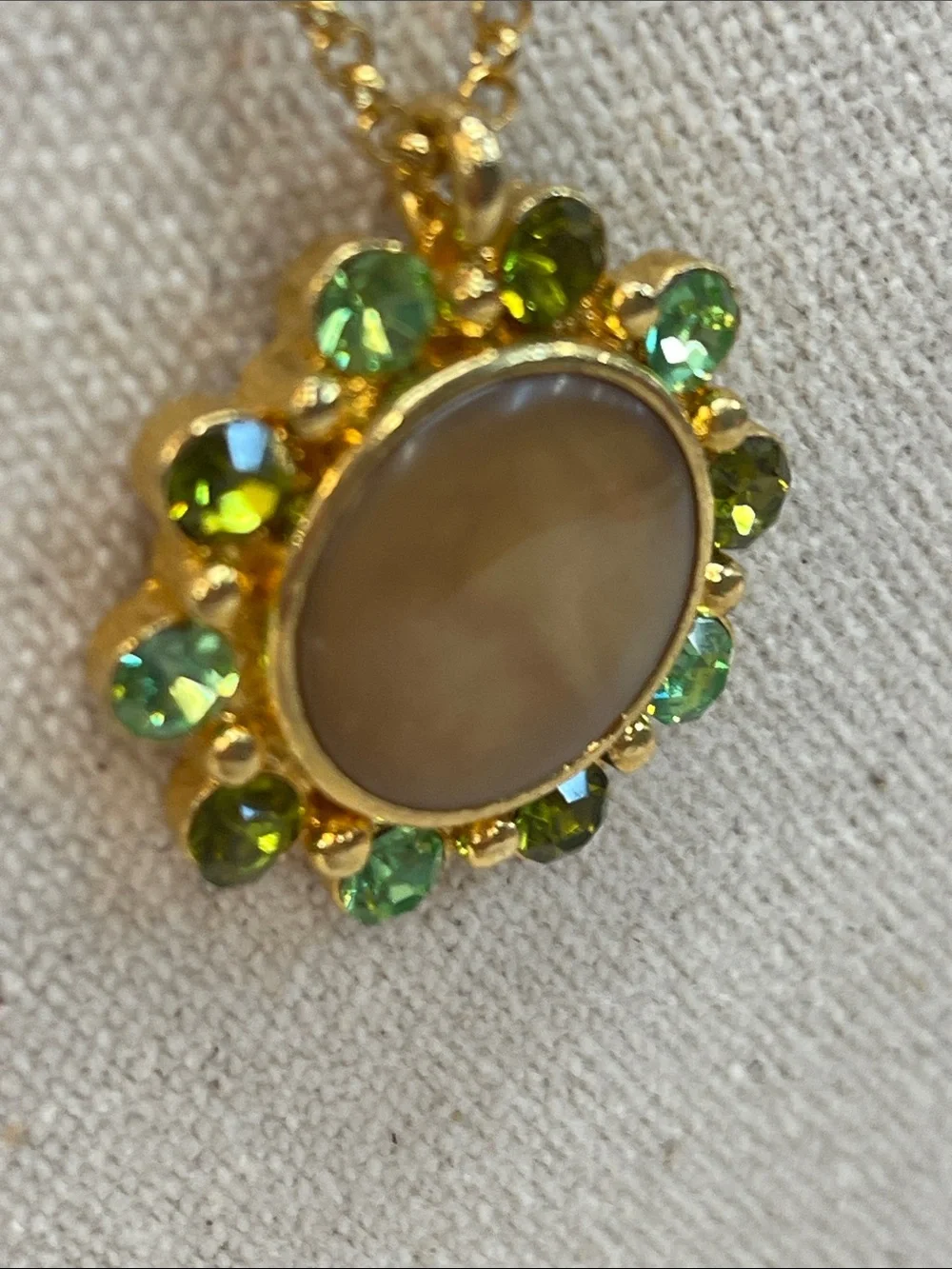 Gold-Tone Necklace with Beige Center and Green Crystal Halo
